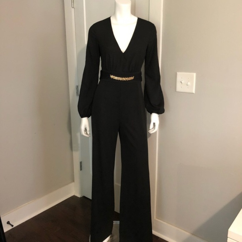 Black Bebe jumpsuit with gold chain belt